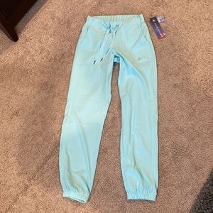 Mint green XS white cross FIT scrub bottoms BNWT